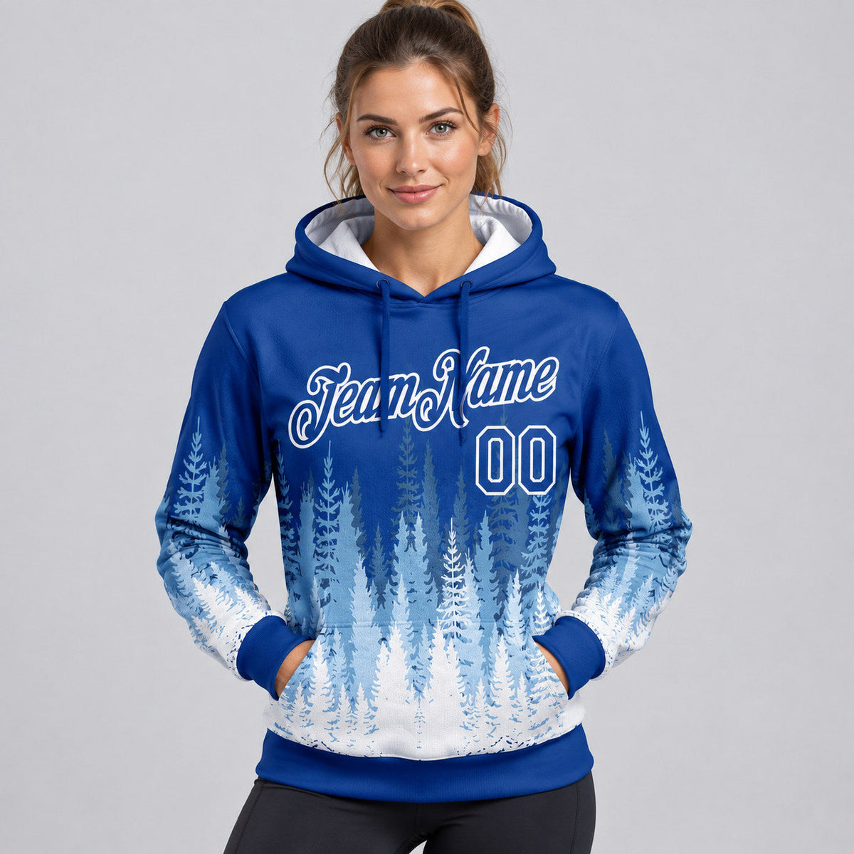 Custom Royal Christmas Tree Pullover Hoodie with White Lettering worn by female model