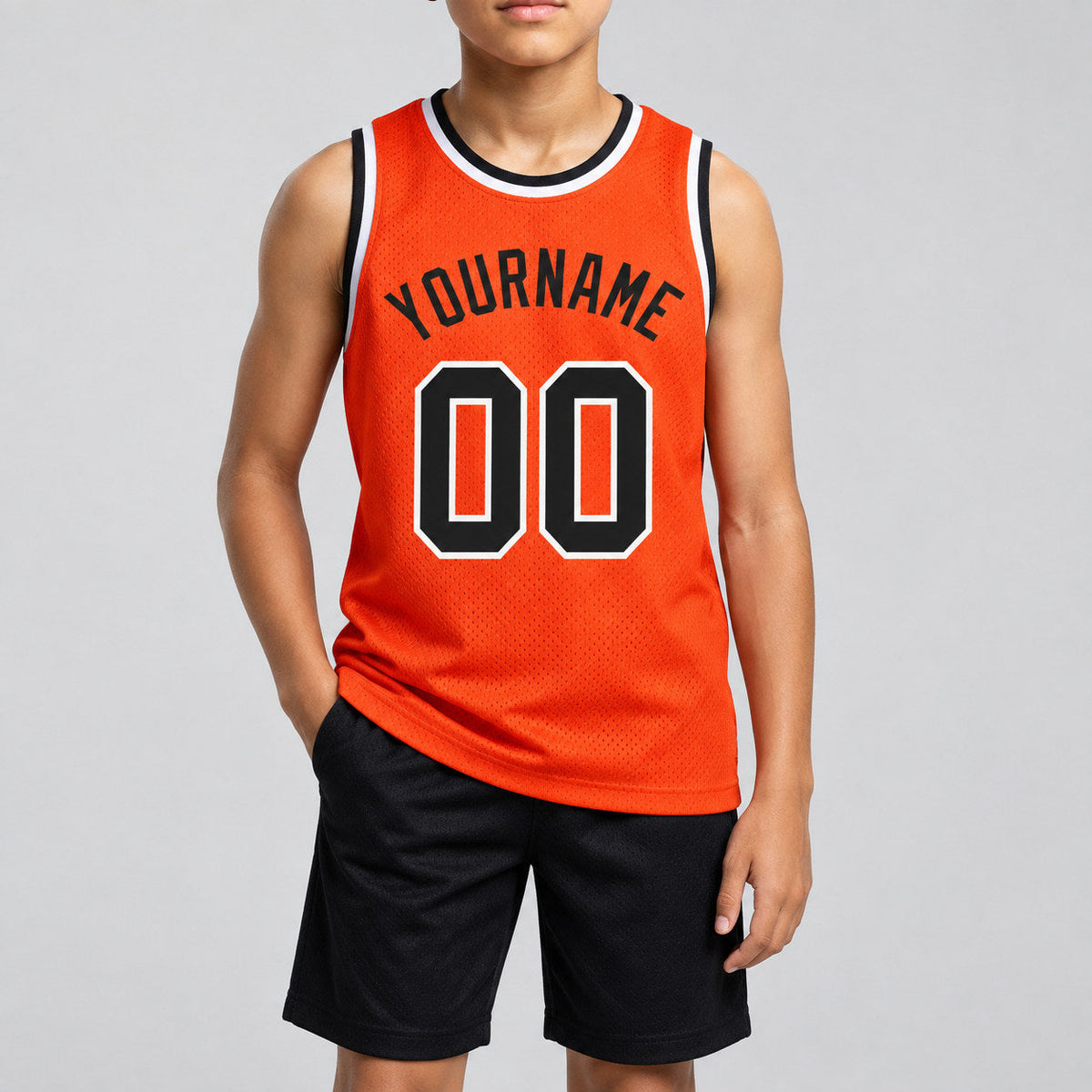 Custom Orange Authentic Throwback Basketball Jersey with Black and White Lettering Design 0352 youth size worn by child model