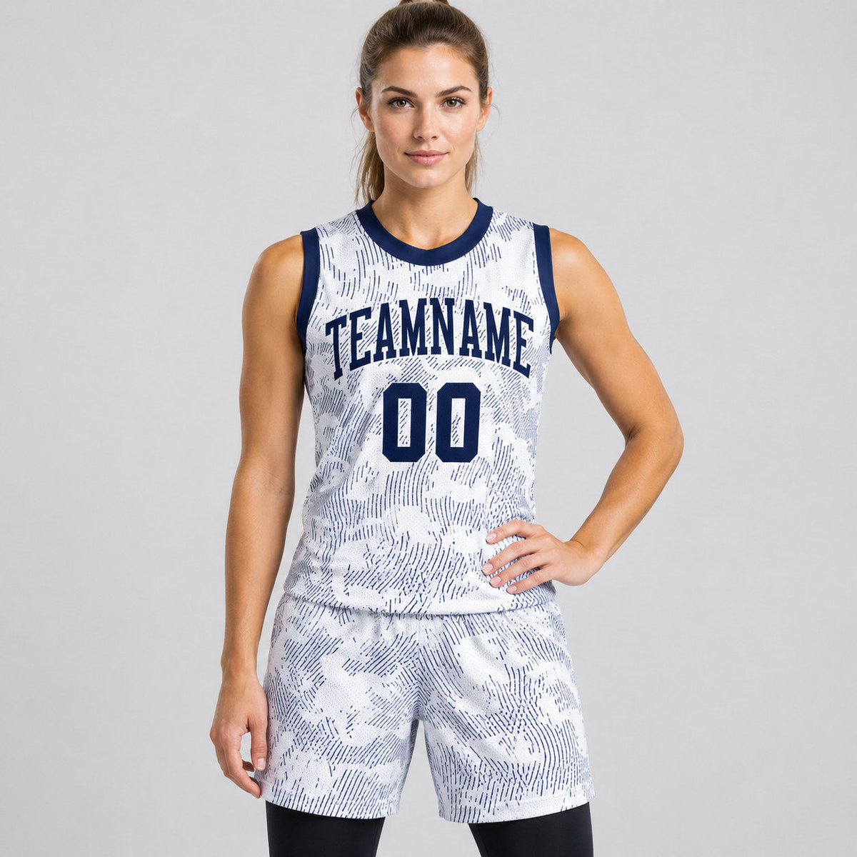 Custom White Round Neck Sublimated Basketball Jersey with Navy Lettering worn by female model
