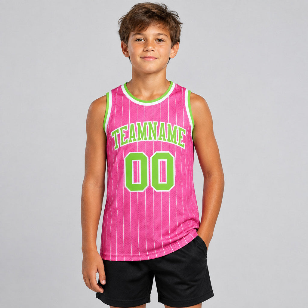Custom Pink and White Pinstripe Authentic Basketball Jersey with Neon Green and White Lettering youth size worn by child model