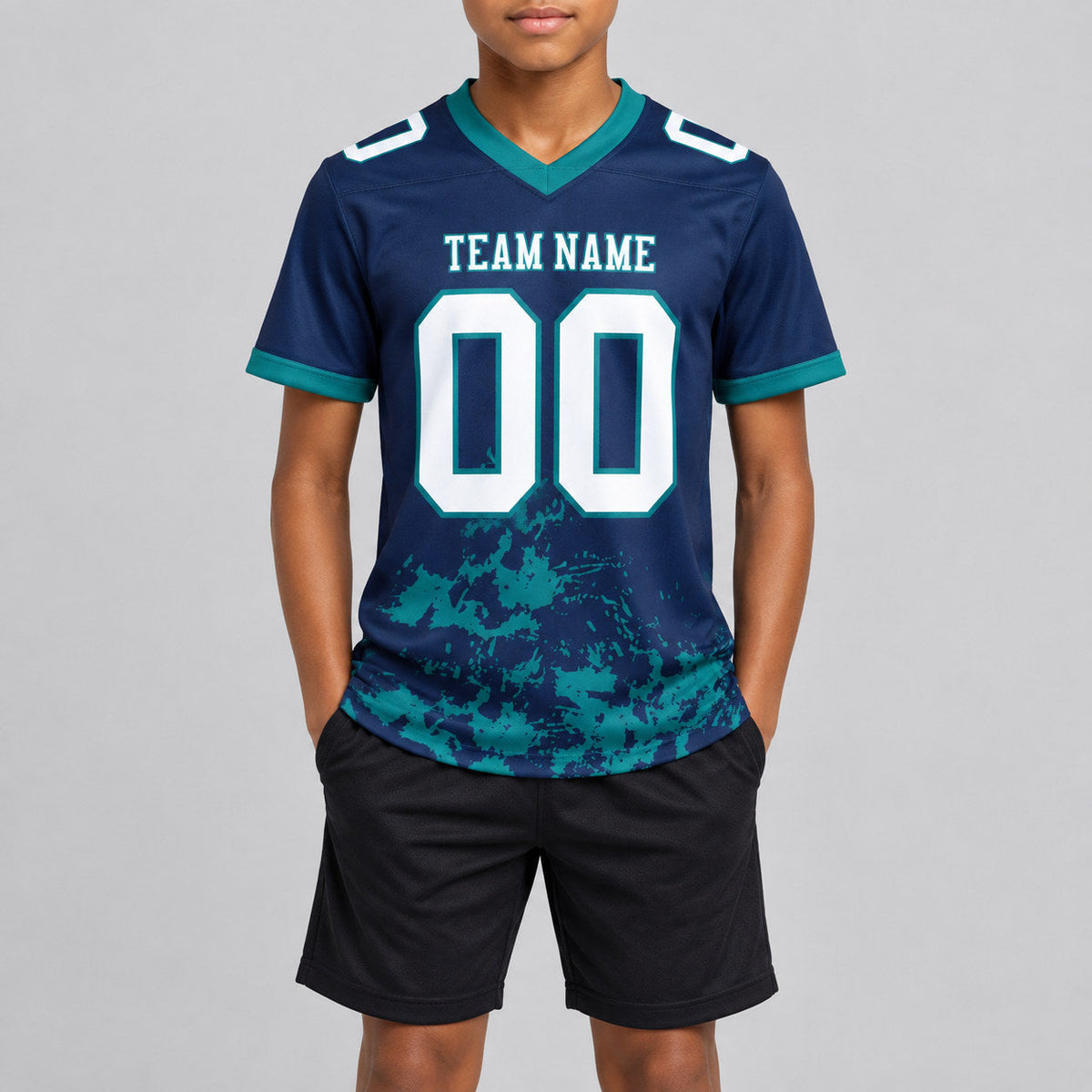 Custom Navy Splash Authentic Football Jersey with White and Teal Lettering youth size worn by child model