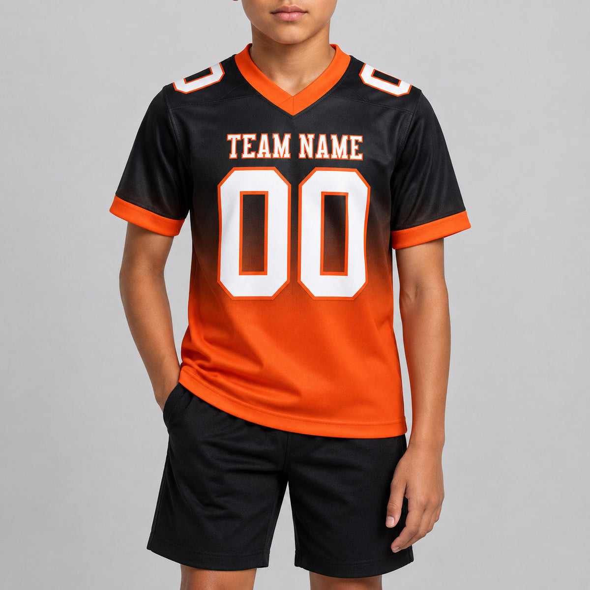 Custom Black Fade Authentic Football Jersey with White and Orange Lettering youth size worn by child model