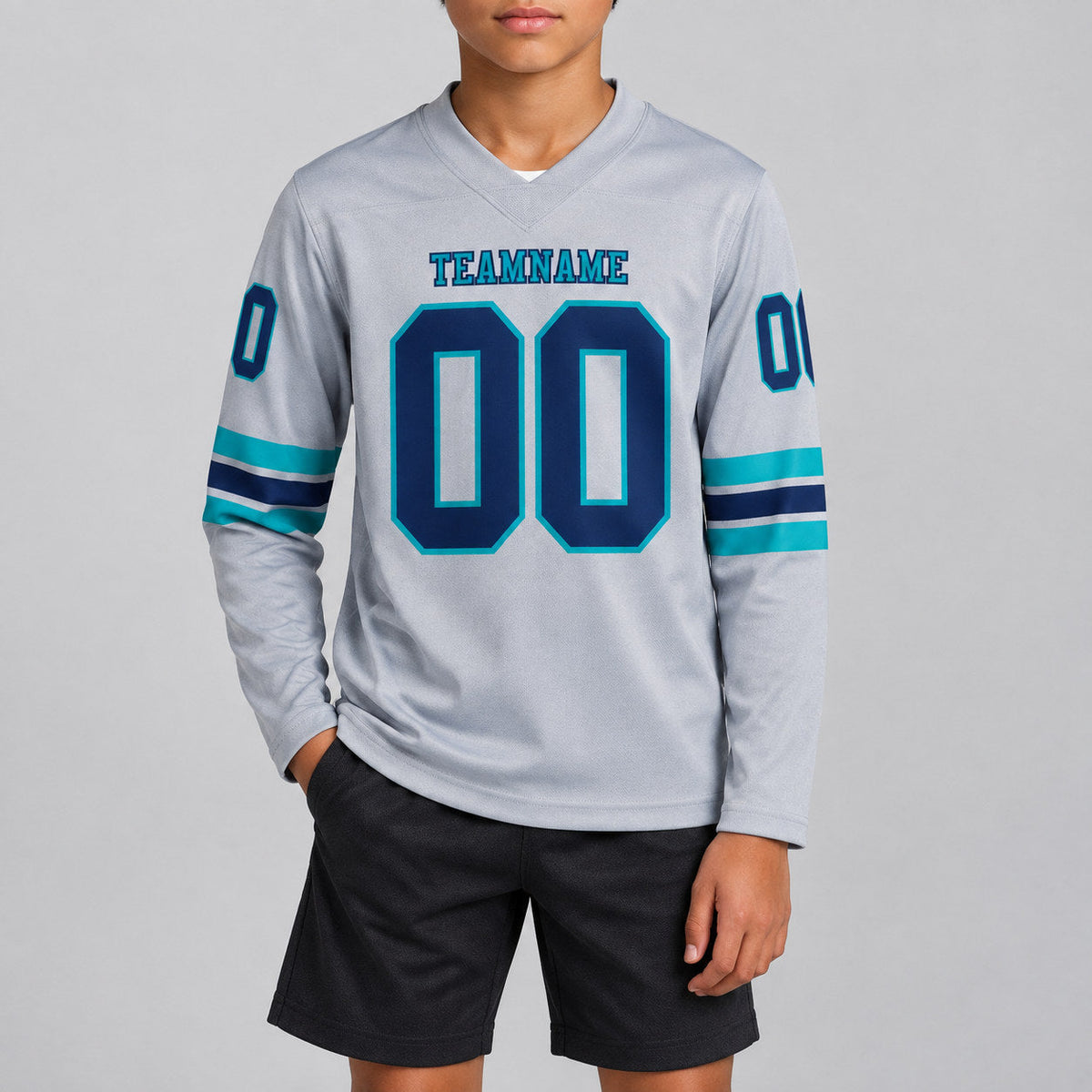Custom Gray Long Sleeve Authentic Football Jersey with Navy and Teal Lettering youth size worn by child model
