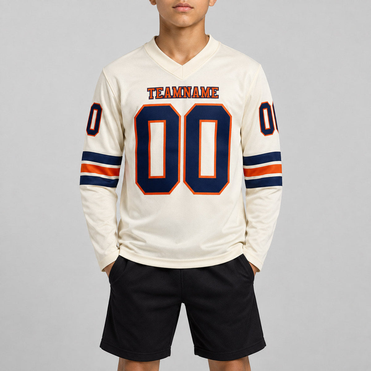 Custom Cream Long Sleeve Authentic Football Jersey with Navy and Orange Lettering youth size worn by child model