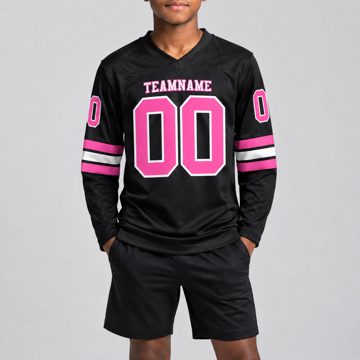 Custom Black Long Sleeve Authentic Football Jersey with Pink and White Lettering youth size worn by child model
