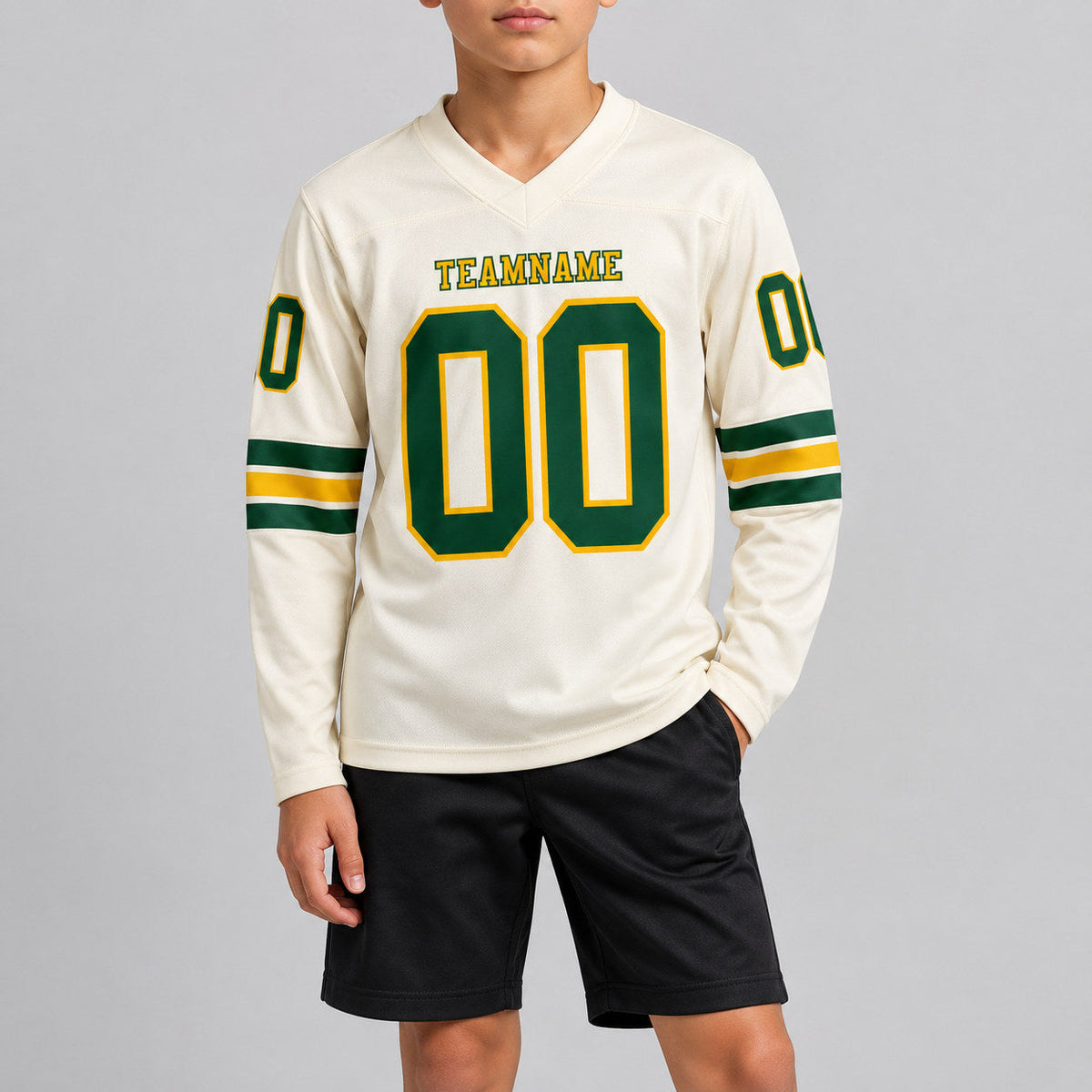 Custom Cream Long Sleeve Authentic Football Jersey with Green and Gold Lettering youth size worn by child model