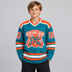 Custom Teal Hockey Jersey with Orange and White Lettering youth size worn by child model