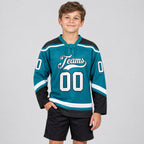 Custom Teal Lace Neck Hockey Jersey with White and Black Lettering youth size worn by child model