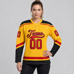 Custom Gold Lace Neck Hockey Jersey with Red and Black Lettering worn by female model