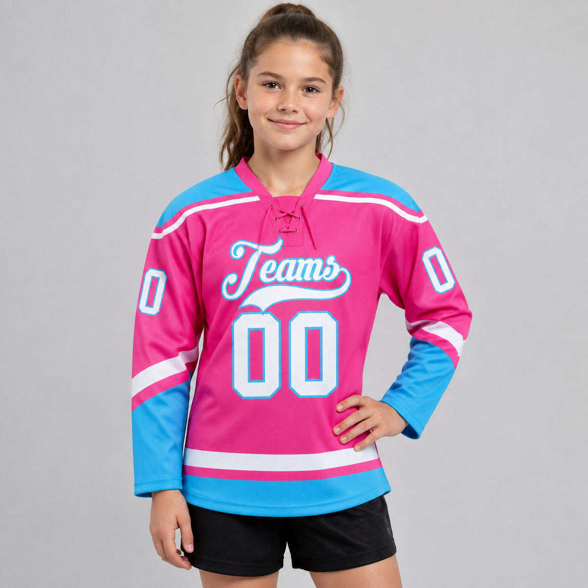 Custom Pink Lace Neck Hockey Jersey with White and Sky Blue Lettering youth size worn by child model