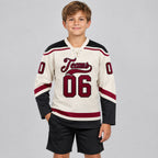 Custom Cream Lace Neck Hockey Jersey with Maroon and Black Lettering Design 0560 youth size worn by child model