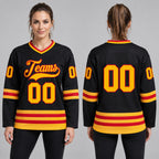 Custom Black Hockey Jersey with Gold and Red Lettering Design 0592 worn by female model