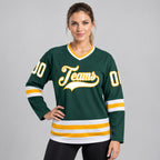 Custom Green Hockey Jersey with White and Gold Lettering worn by female model
