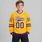 Custom Gold Hockey Jersey with Purple and White Lettering Design 0199 youth size worn by child model
