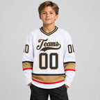Custom White Hockey Jersey with Steel Gray and Old Gold Lettering Design 0663 youth size worn by child model