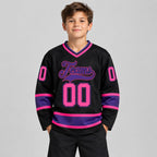 Custom Black Hockey Jersey with Pink and Purple Lettering youth size worn by child model