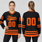 Custom Black Hockey Jersey with Orange Lettering Design 2453 worn by female model