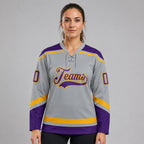 Custom Gray Lace Neck Hockey Jersey with Purple and Gold Lettering worn by female model