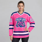 Custom Pink Hockey Jersey with White and Royal Lettering worn by female model