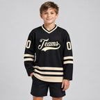 Custom Black Hockey Jersey with Cream Lettering youth size worn by child model