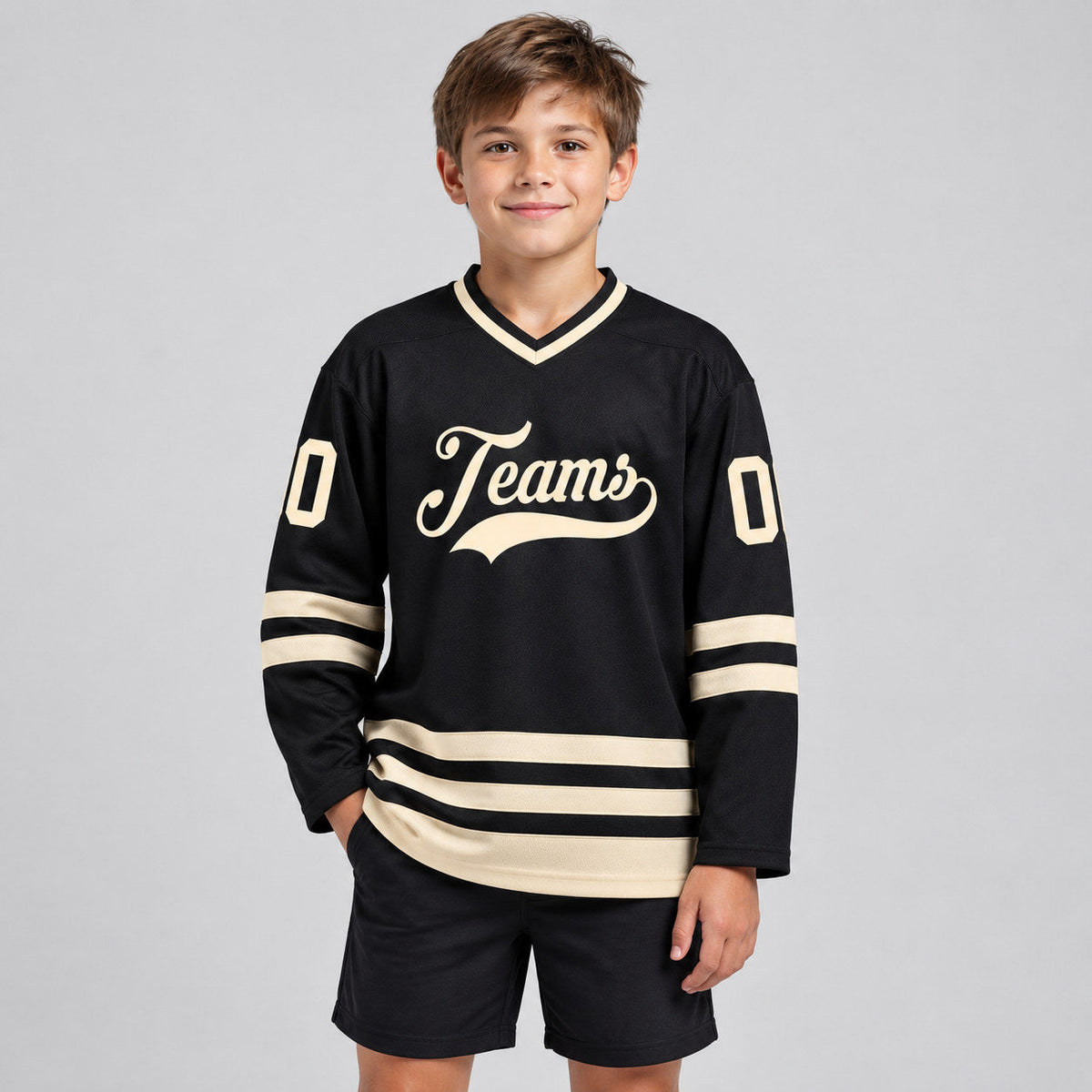 Custom Black Hockey Jersey with Cream Lettering youth size worn by child model