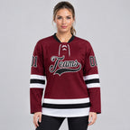 Custom Burgundy Lace Neck Hockey Jersey with Black and White Lettering worn by female model