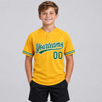 Custom Gold Two Button Softball Jersey with Kelly Green and White Lettering youth size worn by child model