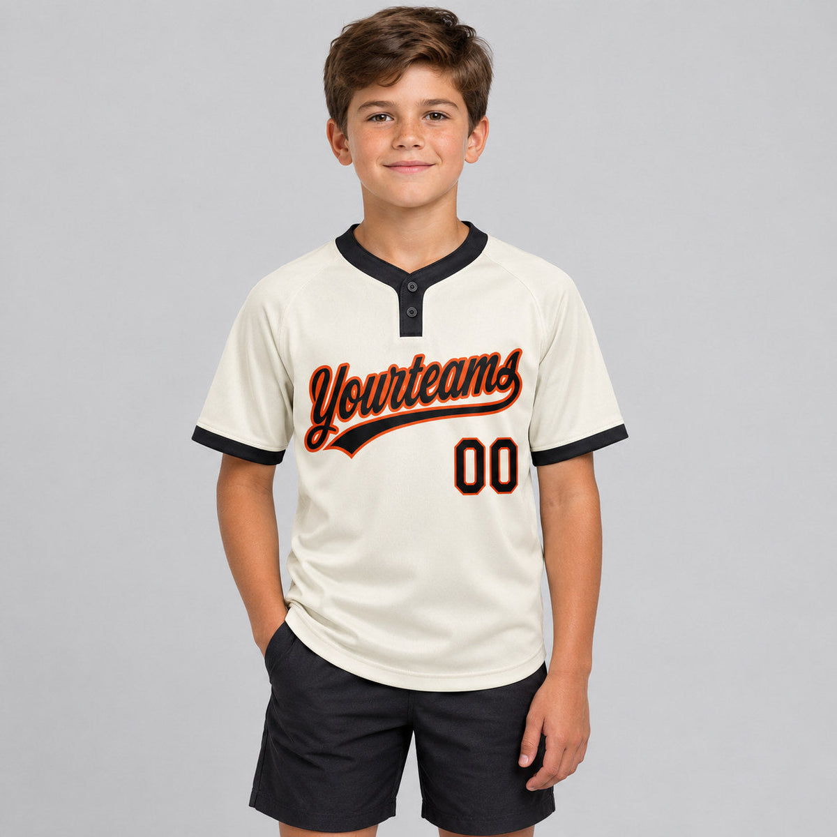 Custom Cream Two Button Softball Jersey with Black and Orange Lettering Design 0188 youth size worn by child model