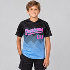 Custom Black Gradient Square Shapes Two Button Softball Jersey with Pink and Light Blue Lettering Design 0747 youth size worn by child model