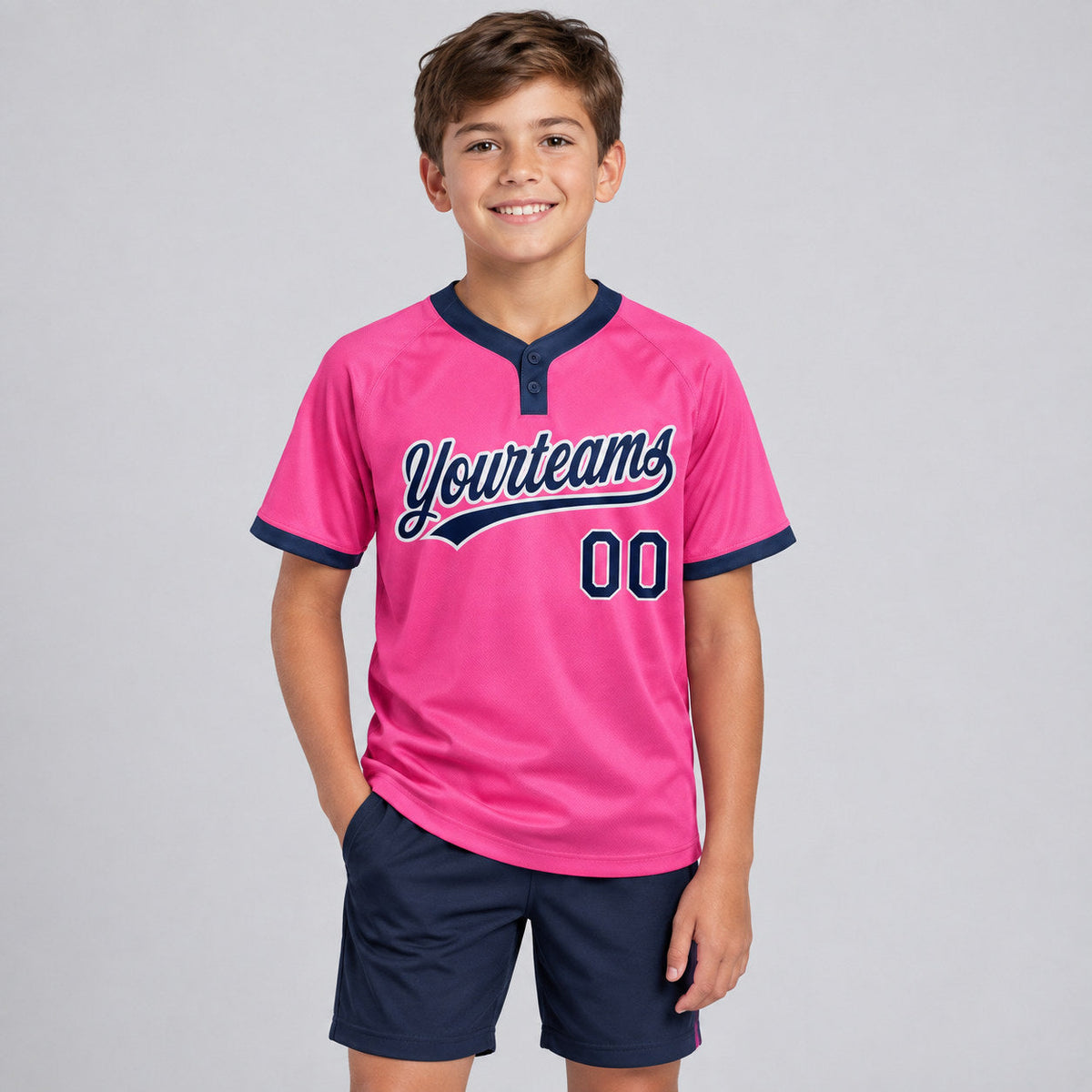 Custom Pink Two Button Softball Jersey with Navy and White Lettering youth size worn by child model
