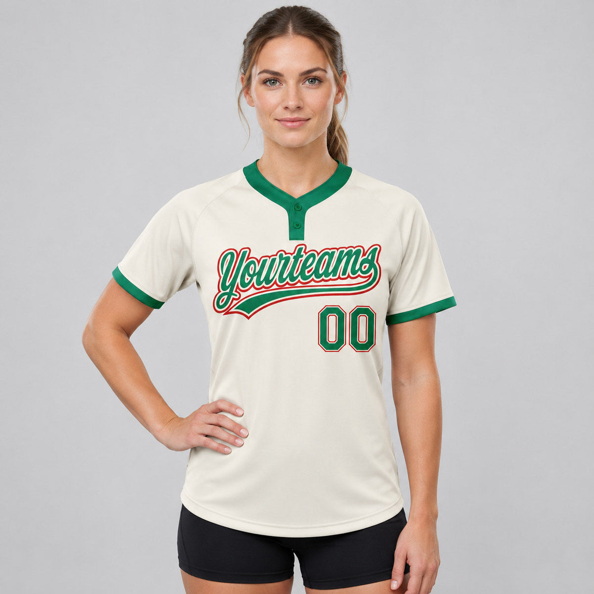 Custom Cream Two Button Softball Jersey with Kelly Green and Red Lettering worn by female model