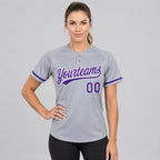 Custom Gray Two Button Softball Jersey with Purple and White Lettering worn by female model