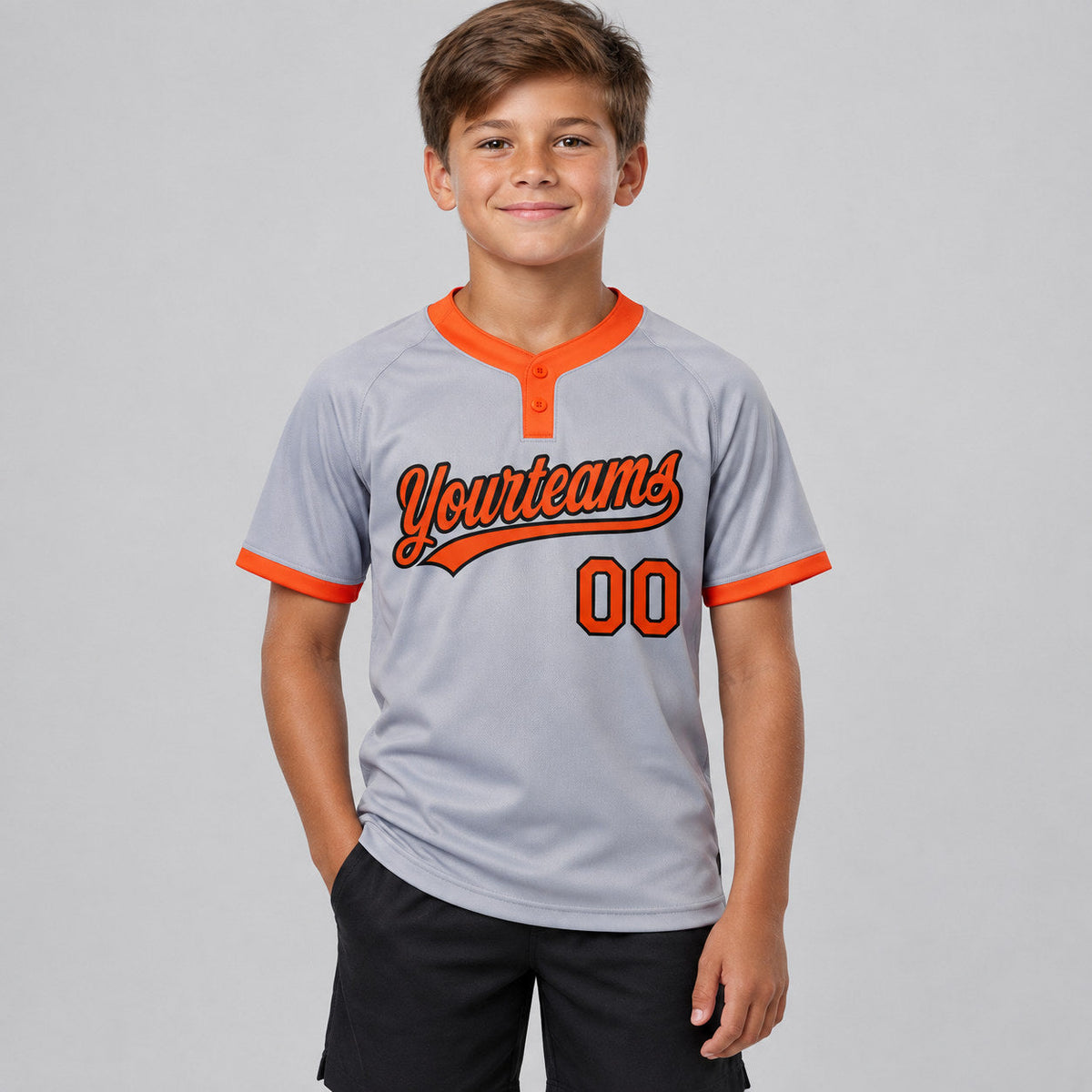 Custom Gray Two Button Softball Jersey with Orange and Black Lettering youth size worn by child model