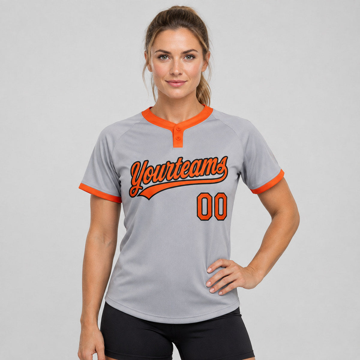 Custom Gray Two Button Softball Jersey with Orange and Black Lettering worn by female model