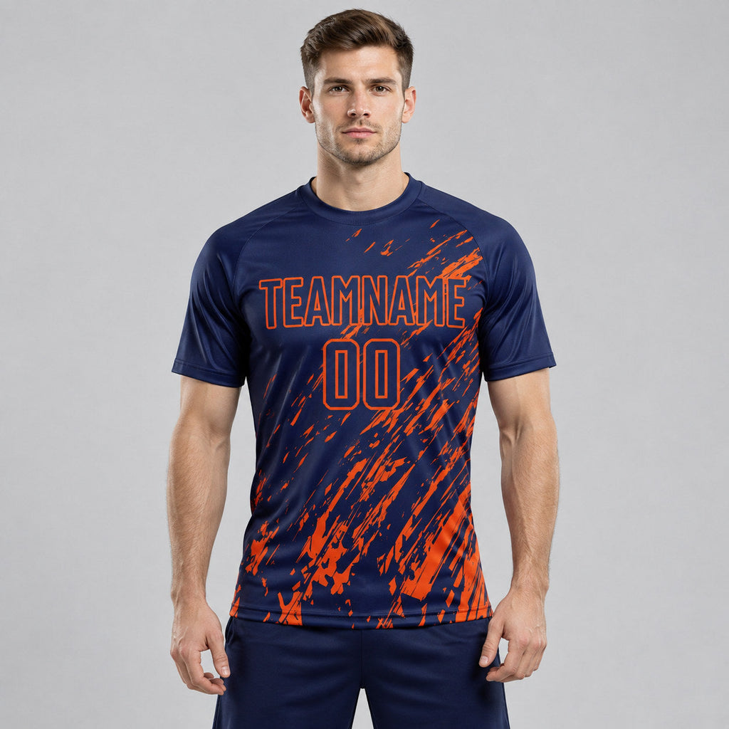 Custom Navy Splash Sublimated Soccer Jersey with Orange Lettering worn by male model