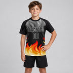 Custom Black and Gray Flame Sublimated Soccer Jersey with Red and Gold Lettering Design 1942 youth size worn by child model