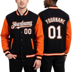 Custom Black White-Orange Bomber Full-Snap Varsity Letterman Two Tone Hoodie Jacket worn front and back