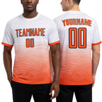 Custom White Orange-Black Gradient Line Sublimation Soccer Uniform Jersey worn front and back